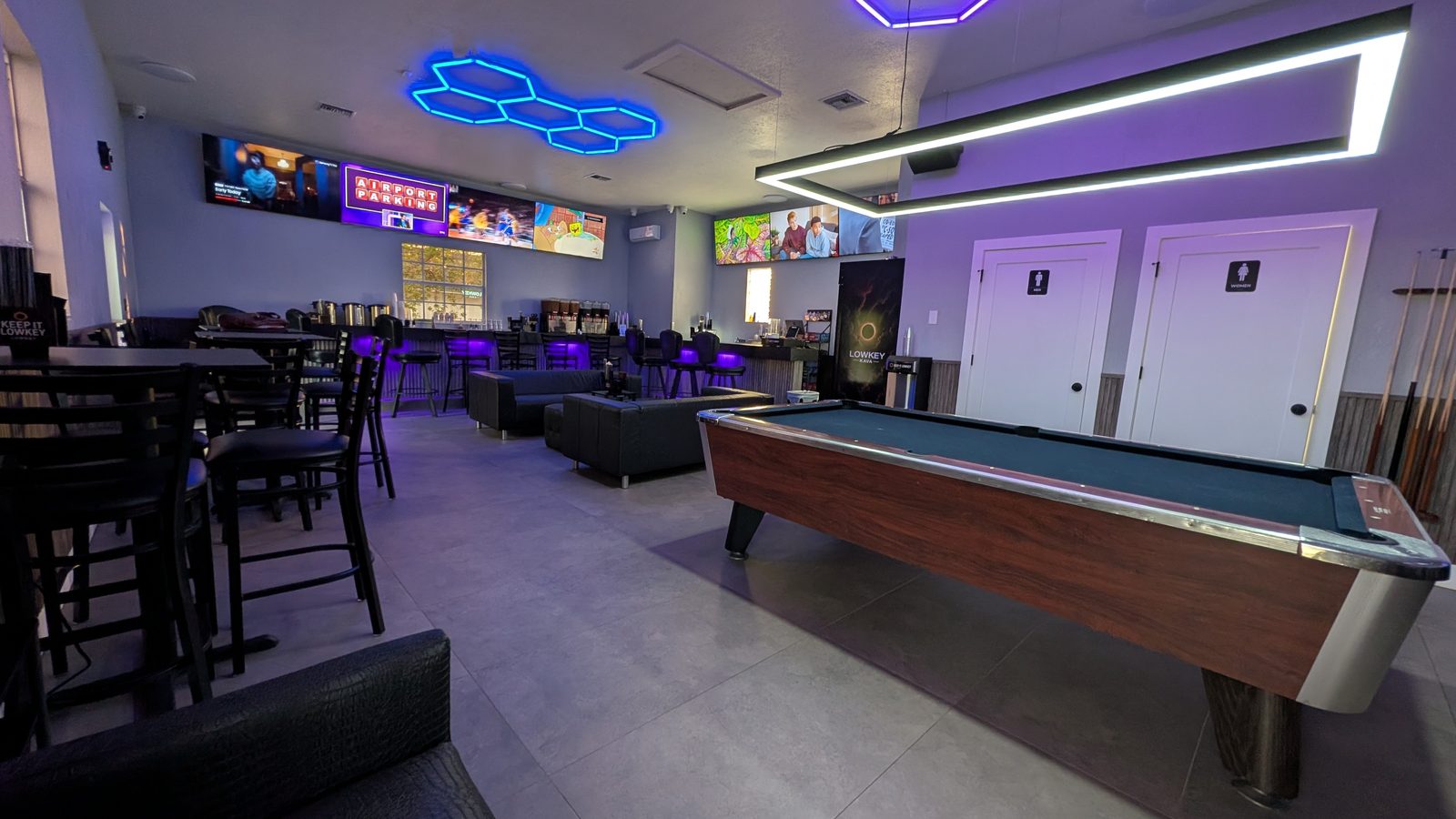 Pool table under neon hex lighting inside Lowkey Kava, West Palm Beach kava bar
