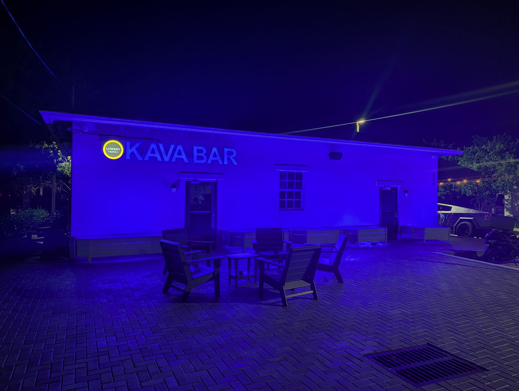 Lowkey Kava standalone kava bar building lit up at night in West Palm Beach 33415