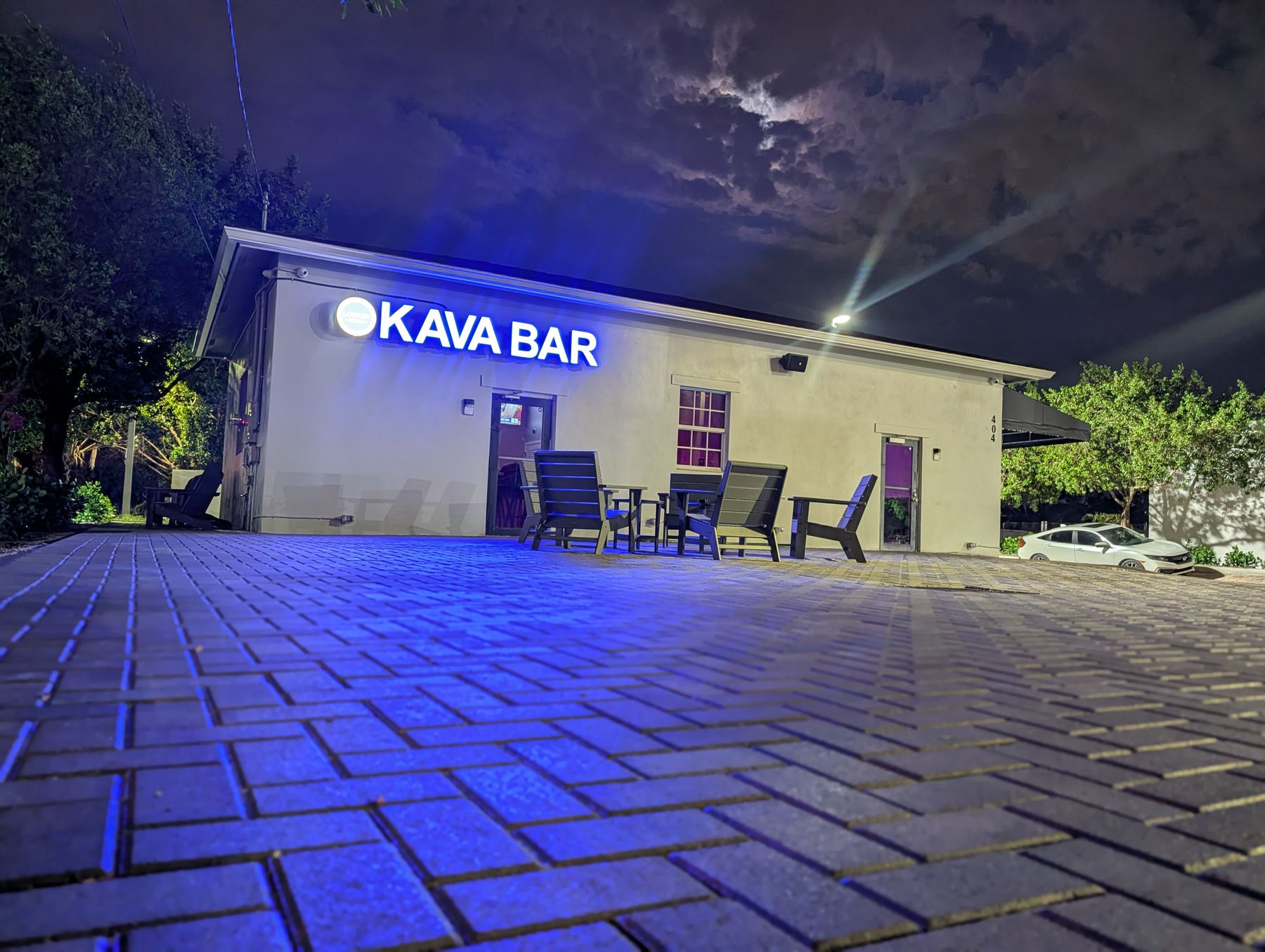 Outdoor patio and brick courtyard seating at Lowkey Kava in West Palm Beach, FL